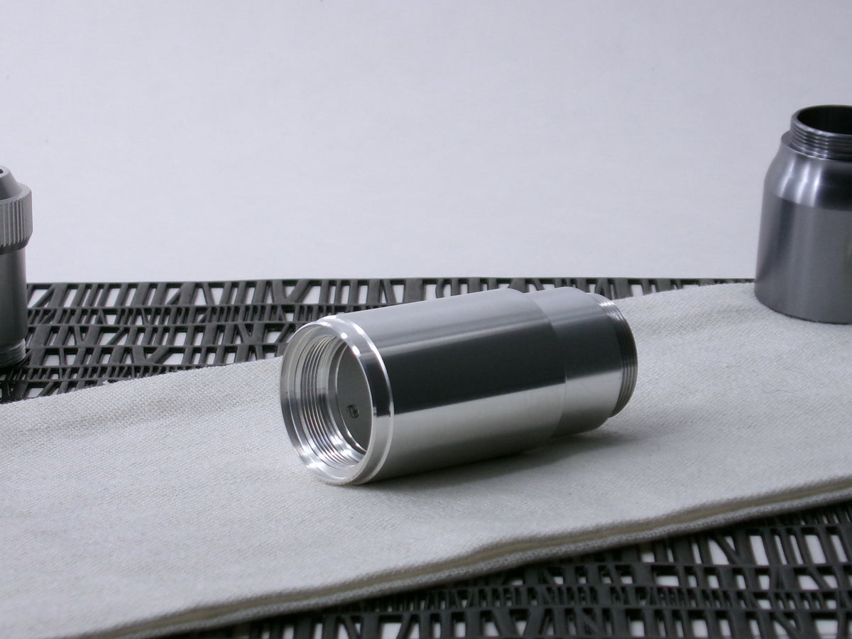 A stepped, VHC-compatible, lightsaber Accent Sleeve sits 3/4 view installed on a CSF Body Segment.