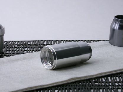 A stepped, VHC-compatible, lightsaber Accent Sleeve sits 3/4 view installed on a CSF Body Segment.