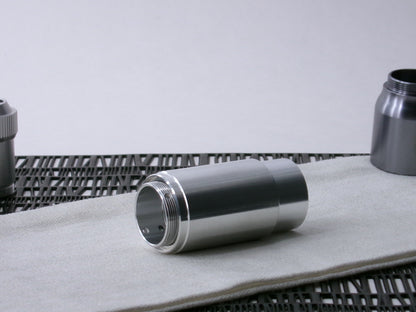 A stepped, VHC-compatible, lightsaber Accent Sleeve sits 3/4 view installed on a CSF Body Segment.