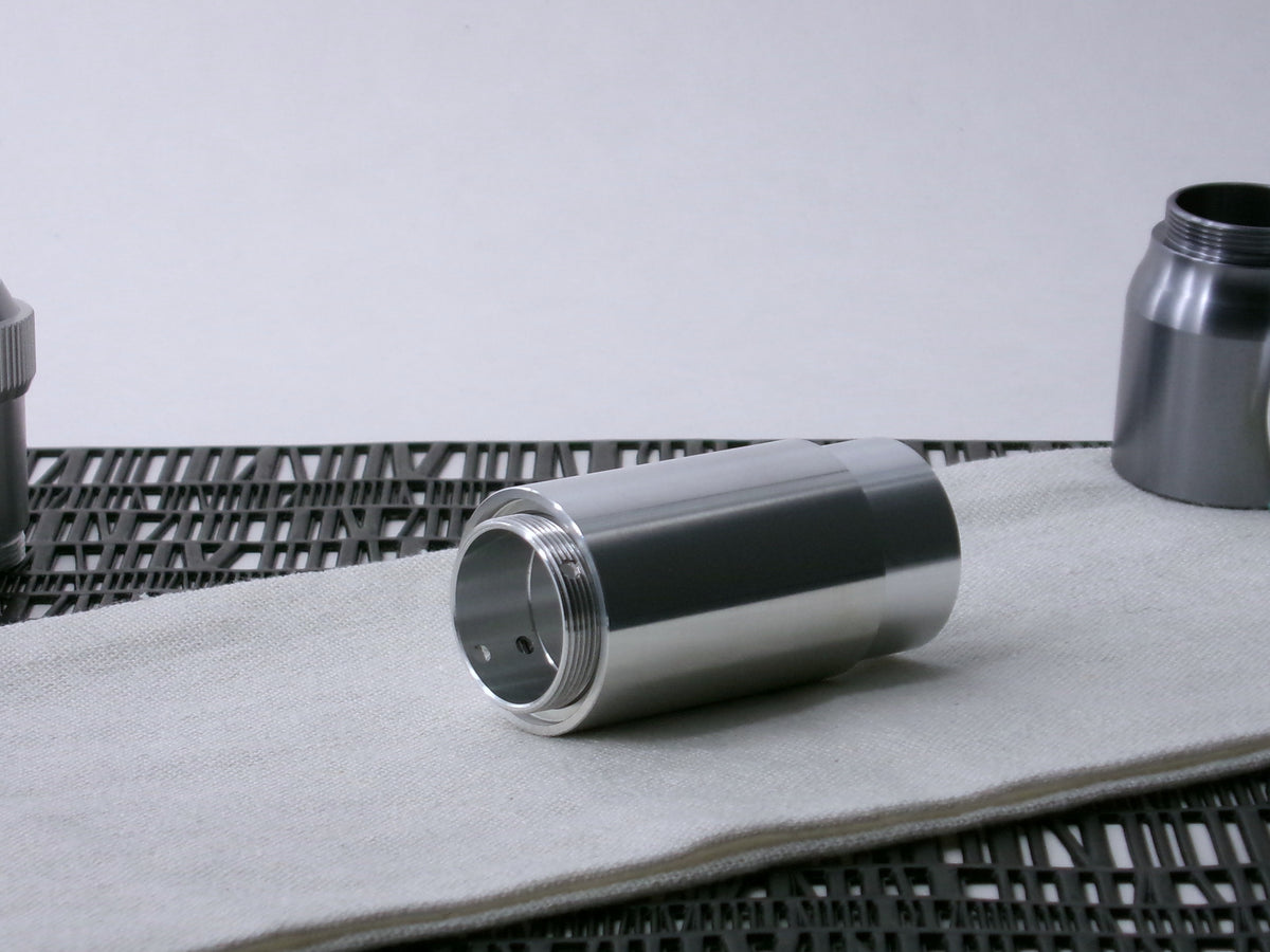 A simple, VHC-compatible, lightsaber Accent Sleeve sits 3/4 view installed on a CSF Body Segment.