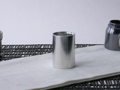 A simple, VHC-compatible lightsaber Accent Sleeve sits vertical on a cloth.