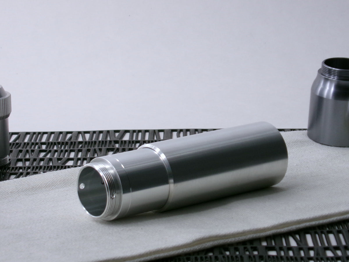 A beveled, VHC-compatible, lightsaber Accent Sleeve sits 3/4 view installed on a CSF Body Segment.