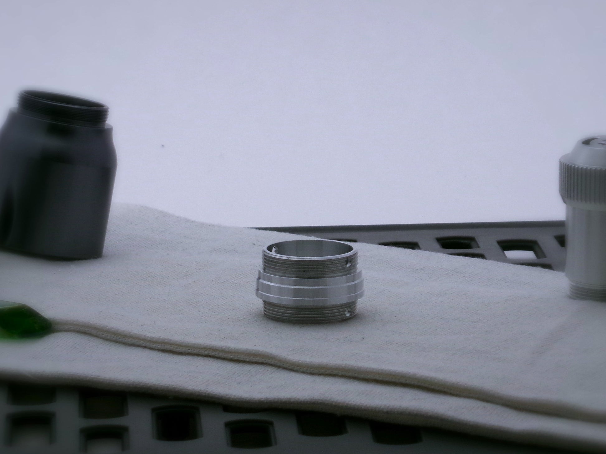 Single aluminum male/male threaded stepped adapter for VHC lightsabers.