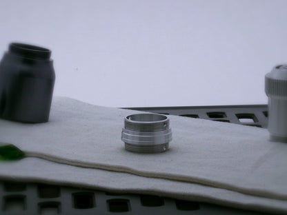 Single aluminum male/male threaded stepped adapter for VHC lightsabers.
