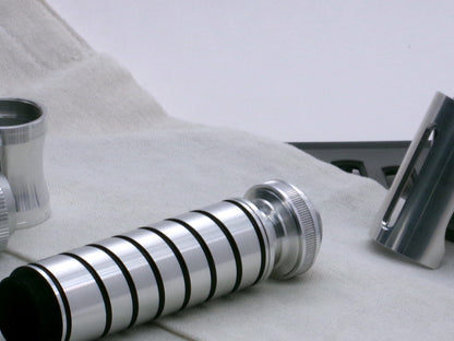 A versatile, aluminum male-to-male hybrid adapter compatible with VHC lightsabers, installed on a VHC grip with Accent Ring Type 1.1 and Pommel Cap Type 1, 3/4 view.