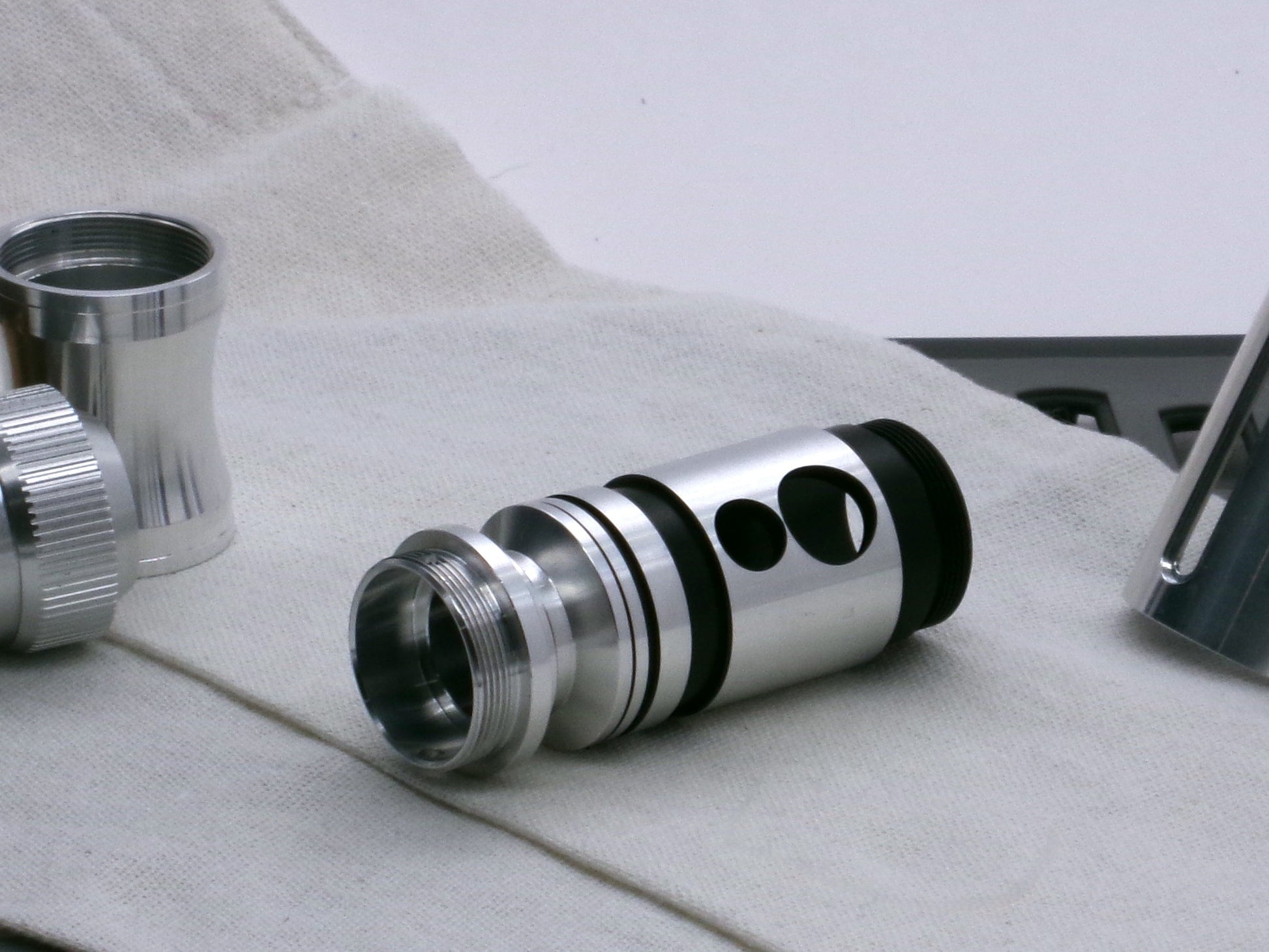 A versatile, aluminum male-to-male hybrid adapter compatible with VHC lightsabers, installed in a VHC switch 3/4 view.