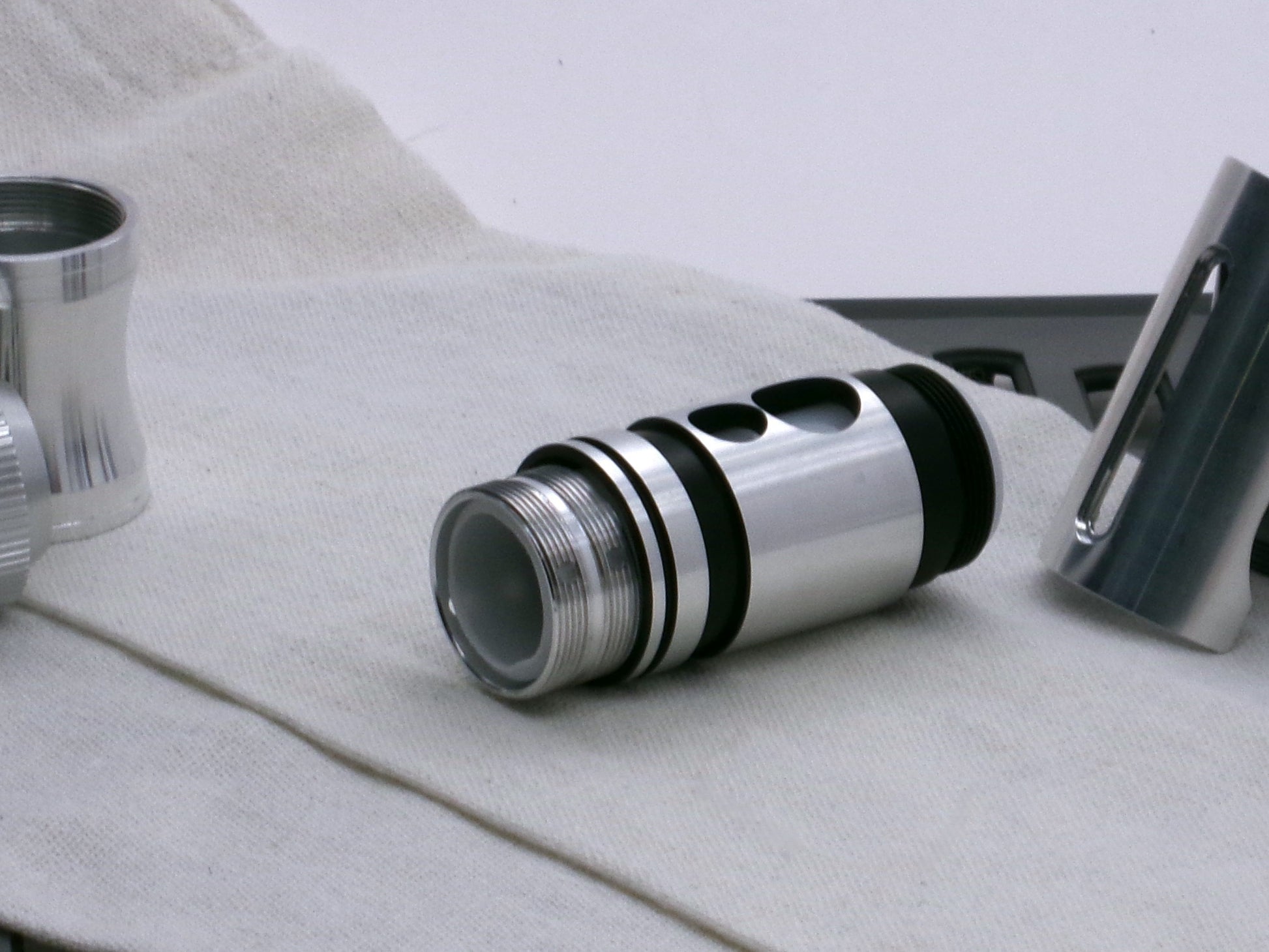 A stealthy, no-show, aluminum male-to-male formatted adapter that hides between female formatted parts in 3/4 view with switch prior to install.