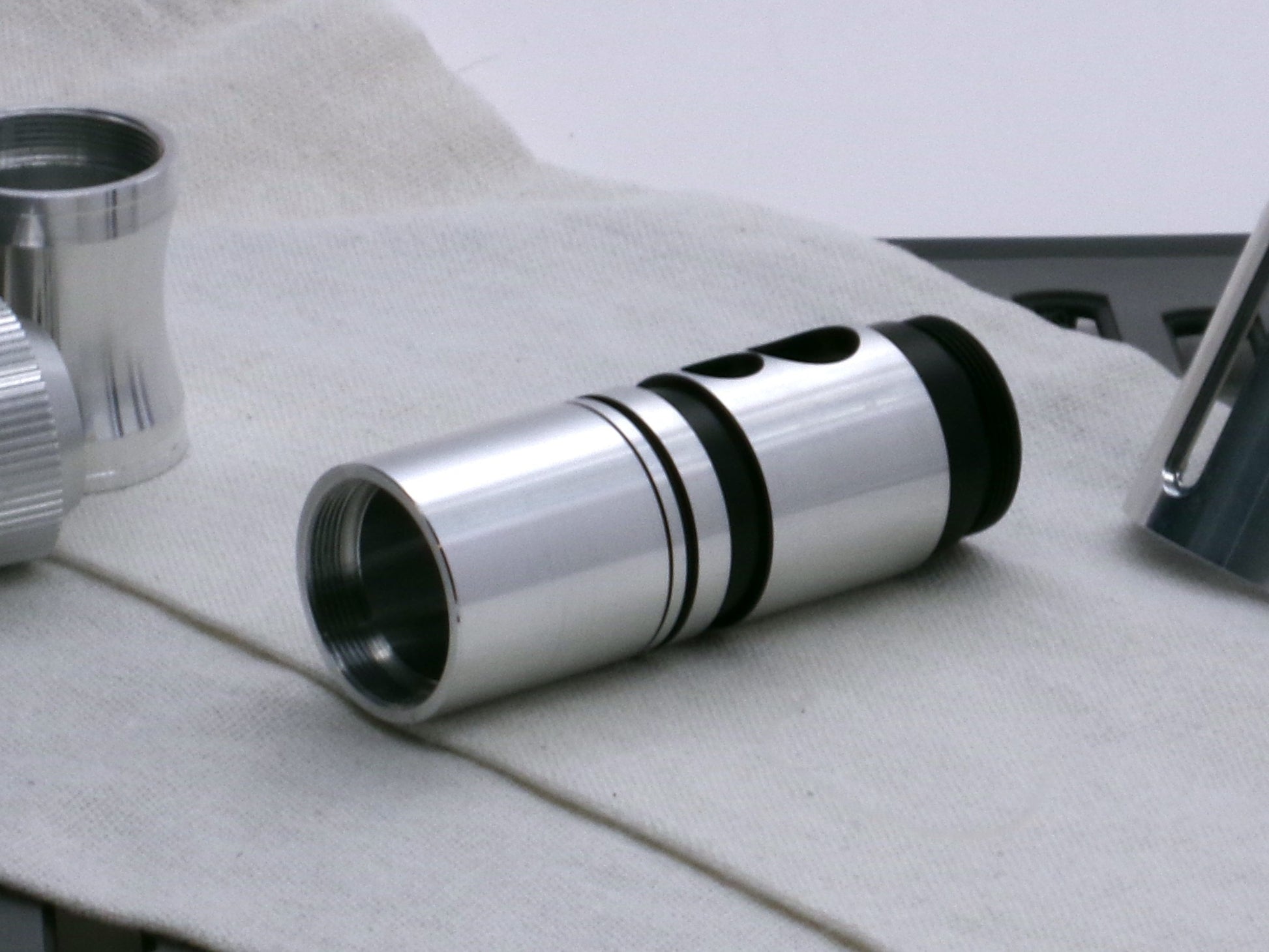 A stealthy, no-show, aluminum male-to-male formatted adapter installed and hidden between female formatted parts.
