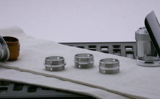 A trio of aluminum, Male/Male threaded adapters of varying diameter for VHC lightsabers.