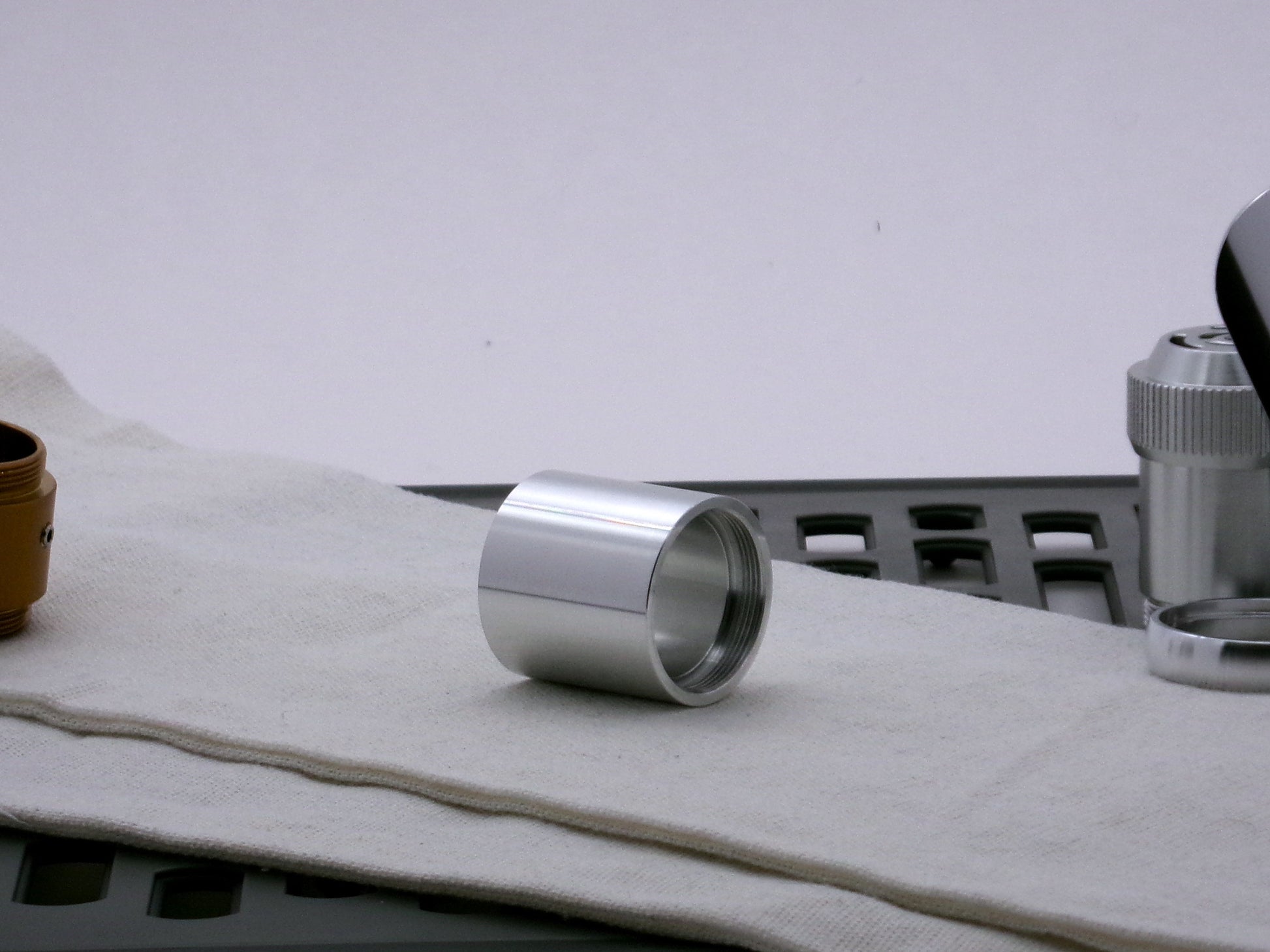 Single aluminum female/female threaded body component for VHC lightsabers; three-quarter view.