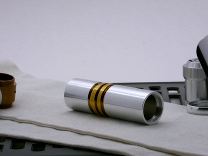Single aluminum female/female threaded body component for VHC lightsabers; standing proud.