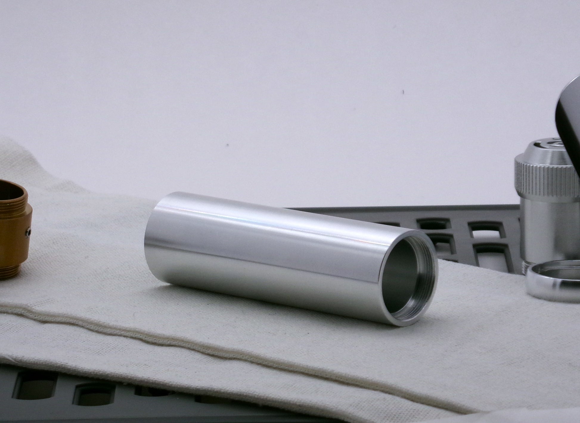 Single aluminum female/female threaded body component for VHC lightsabers; three-quarter view.