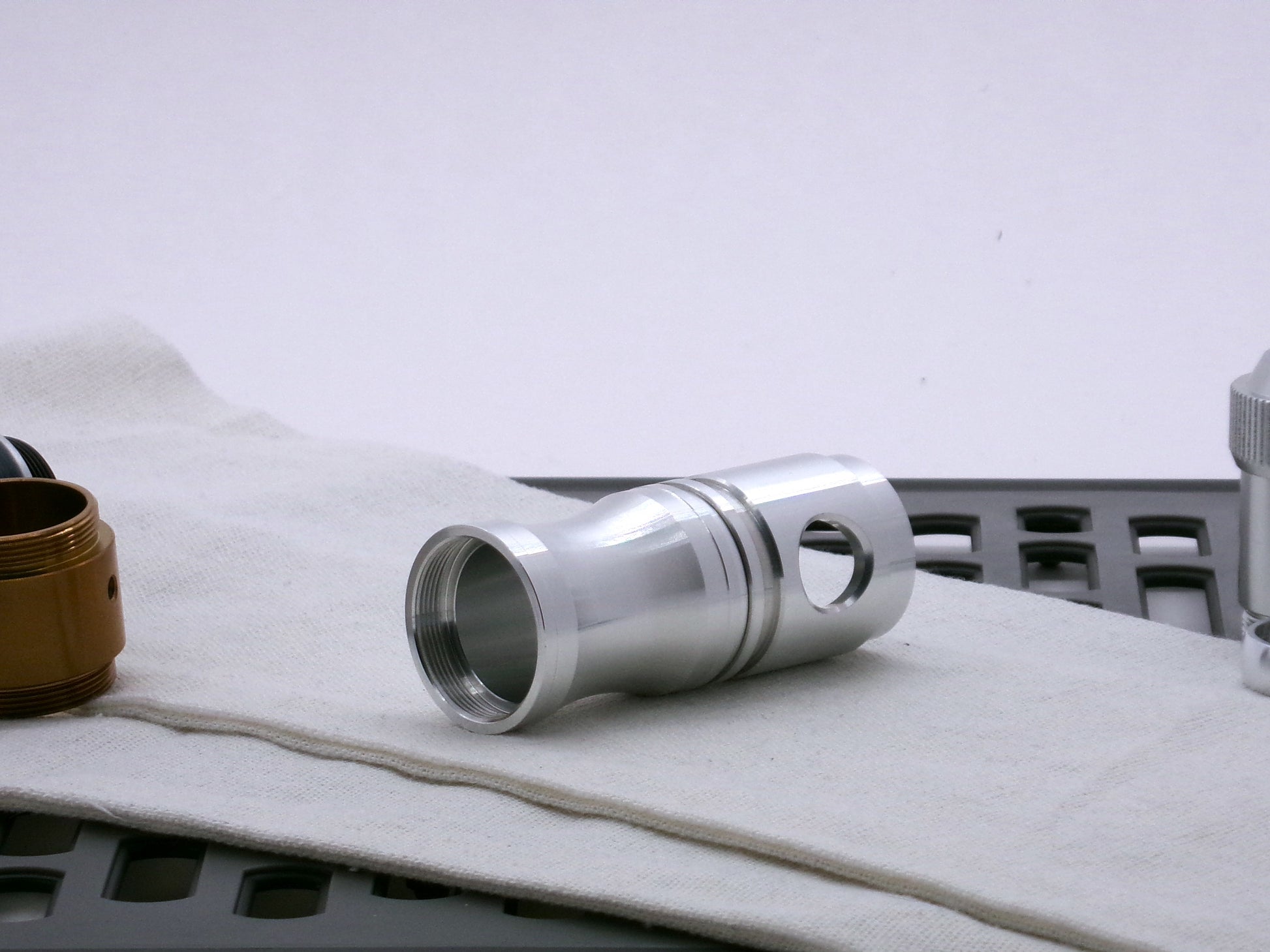 Aluminum female/female threaded curved grip choke installed on a Switch-Type_2.1 for VHC lightsabers; three-quarter view.