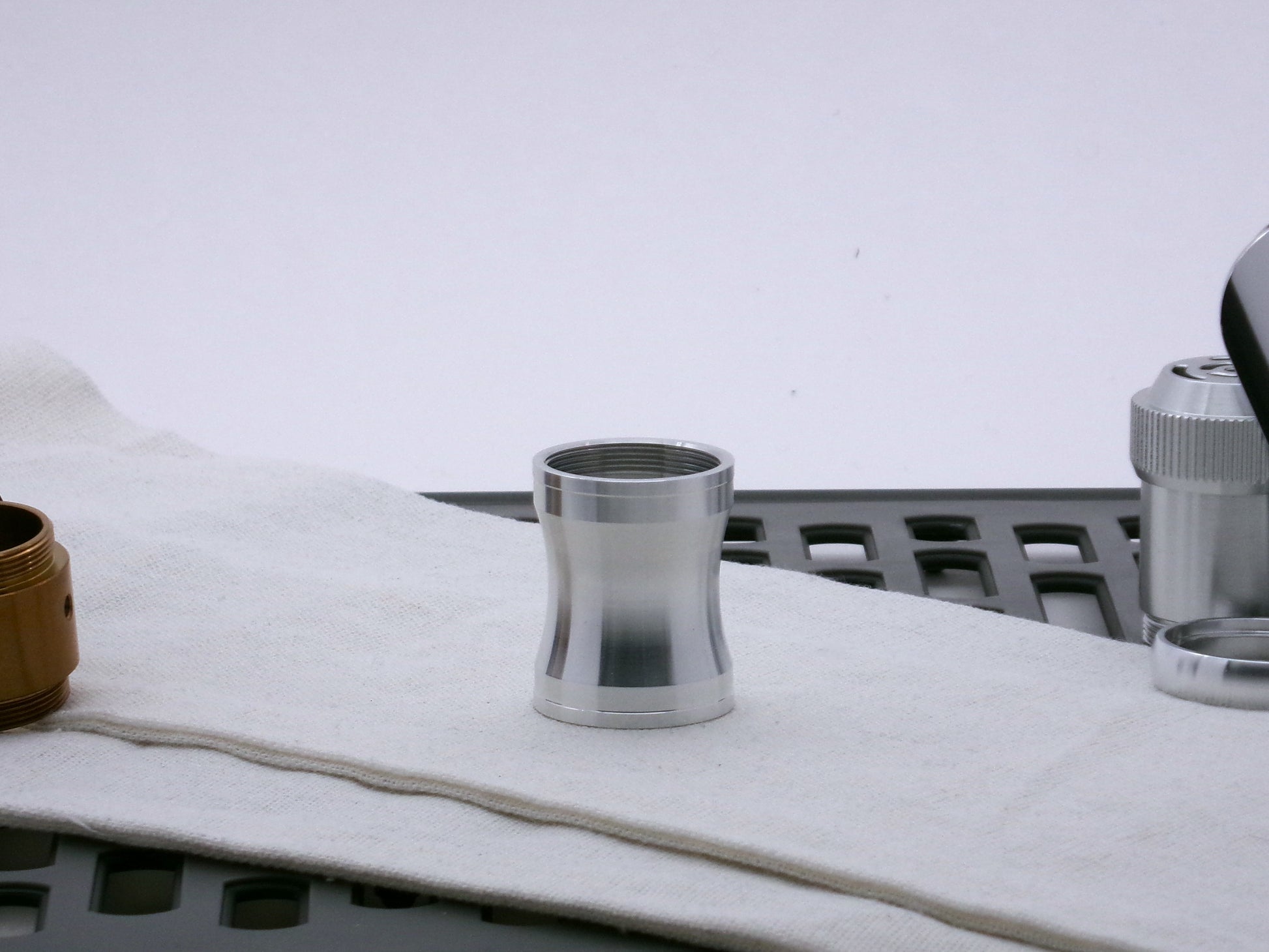 Aluminum female/female threaded curved grip choke for VHC lightsabers; standing proud.