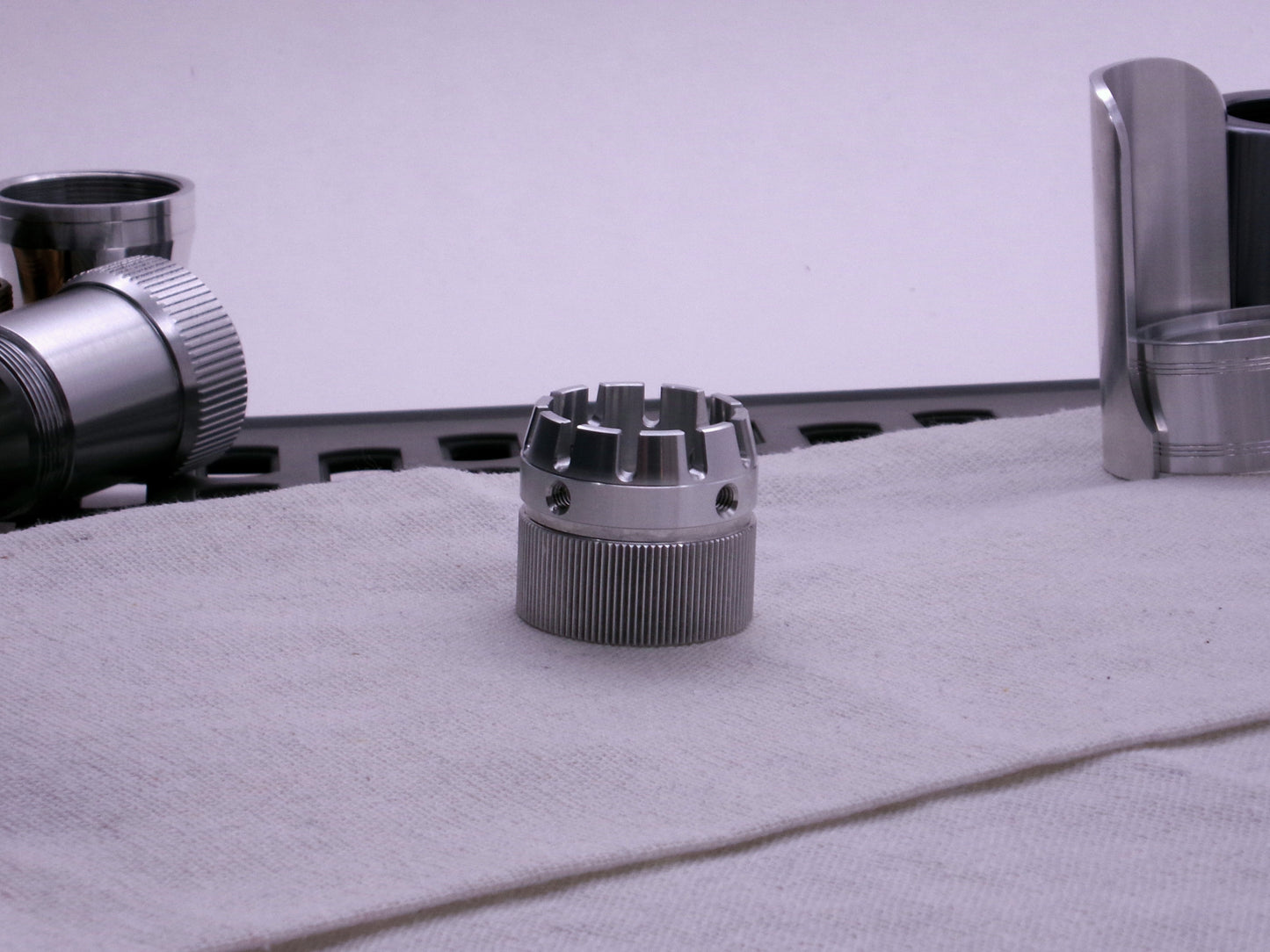 VHC compatible emitter tip connected to a knurled body segment on cloth