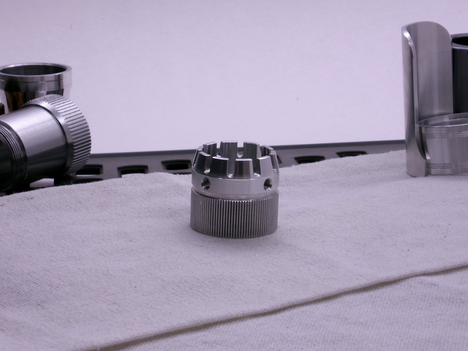 VHC compatible emitter tip connected to a knurled body segment on cloth