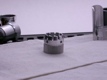 VHC compatible emitter tip connected to a knurled body segment on cloth