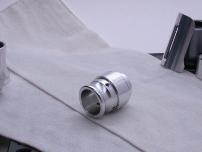 An aluminum VHC compatible emitter tip, completes a mockup shown 3/4 view on a coarse cloth.