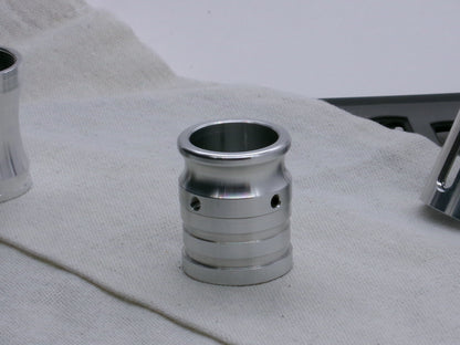 An emitter tip installed on a FF Extension Type 1, standing proud on a coarse cloth.