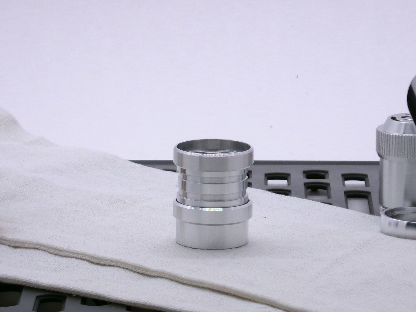 Aluminum female/female threaded ribbed extension for VHC lightsabers installed among various CSF accent rings and body components.