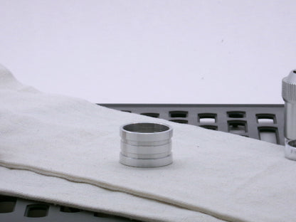 Aluminum female/female threaded ribbed extension for VHC lightsabers; standing proud.