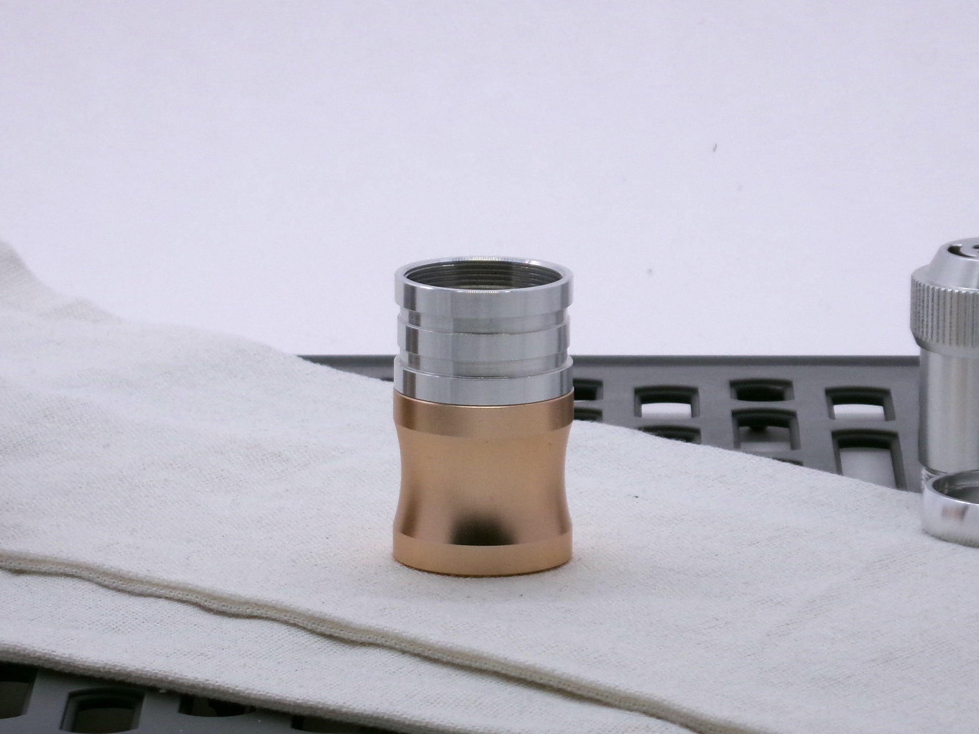 Aluminum female/female threaded ribbed extension for VHC lightsabers installed atop a VHC Choke.