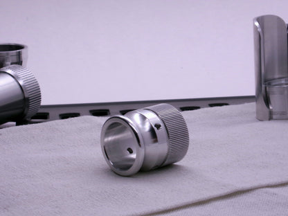 VHC compatible knurled body segment connected to an emitter tip, 3/4 top view on a cloth.