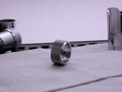 VHC compatible knurled body segment, 3/4 front view sitting on a cloth