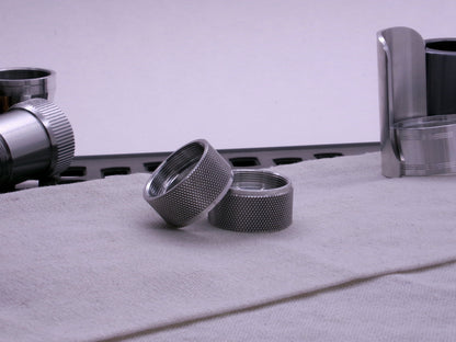 Pair of VHC compatible knurled body segments sitting askew on a cloth