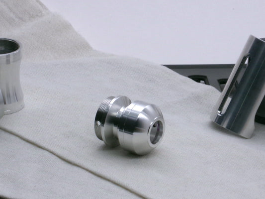 A basic, aluminum female-threaded pommel installed on the Adapter MM Hybrid Type 1 showing rounded profile and sound aperture in 3/4 view.