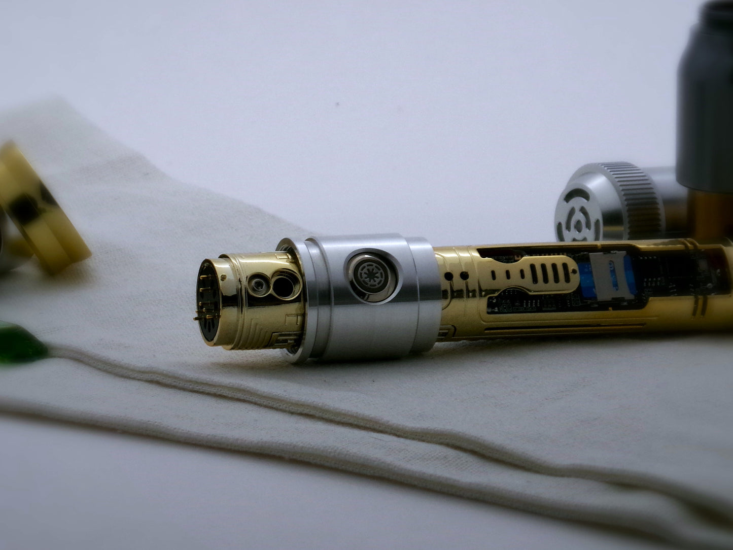 Aluminum female/female threaded switch section installed on a naked chassis for VHC lightsabers; side view.