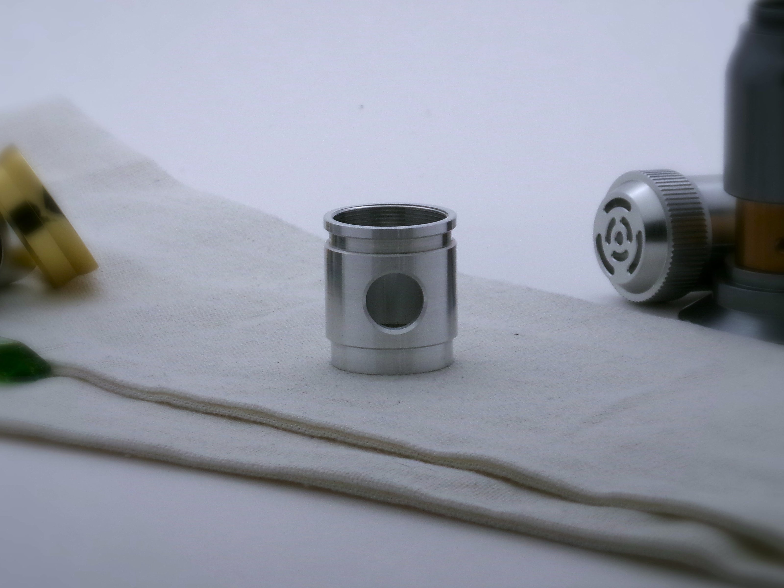 Aluminum female/female threaded switch section formatted for VHC lightsabers; standing proud.